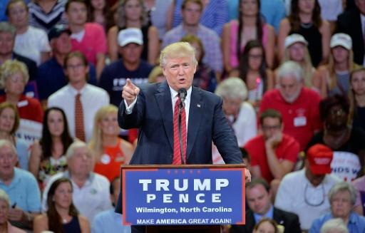 Trump criticized for offhand gun rights slap at Clinton