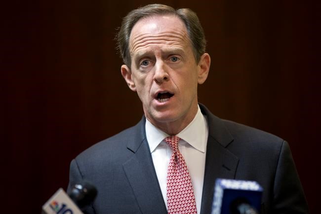 Sen. Pat Toomey R-Pa. speaks during a news conference in Philadelphia. Endangered Toomey is banking on Pennsylvania voters backing him in November even if they oppose fellow Republican Donald Trump a ticket-splittin