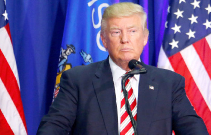 Republican US presidential nominee Donald Trump holds a campaign rally at the Ziegler Building at the Washington County Fair Park & Conference Center in West Bend Wisconsin on Tuesday