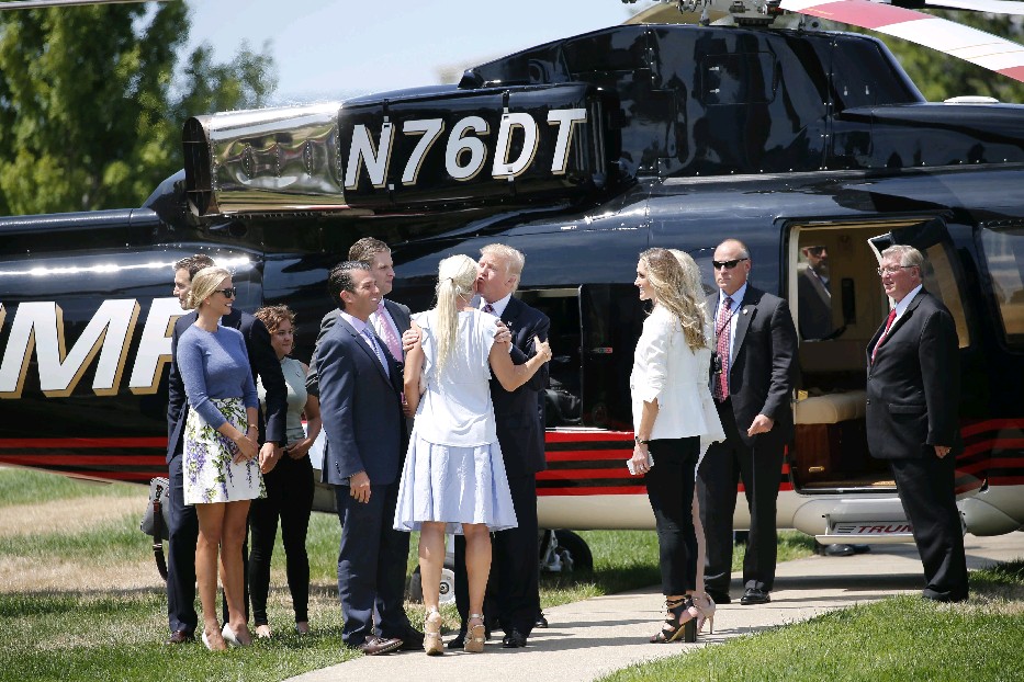 Presidential candidate Donald Trump kisses his daughter Ivanka after landing in his helicopter outside the Great Lakes Science Center as he arrives in Cleveland for the Republican National Convention on Wednesday. Ivanka is scheduled to speak at tonight's