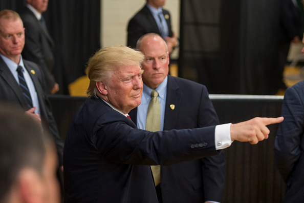 WINDHAM NH- AUGUST 06 Republican presidential candidate Donald Trump points to the crowd following a rally at Windham High School