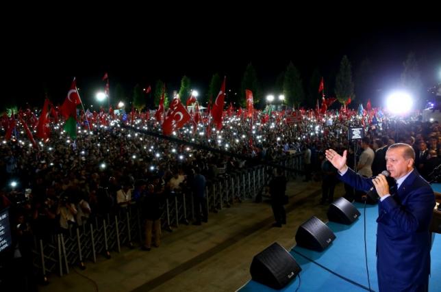 Turkey's President Recep Tayyip Erdogan addresses his supporters in front of the Presidential Palace in Ankara Turkey