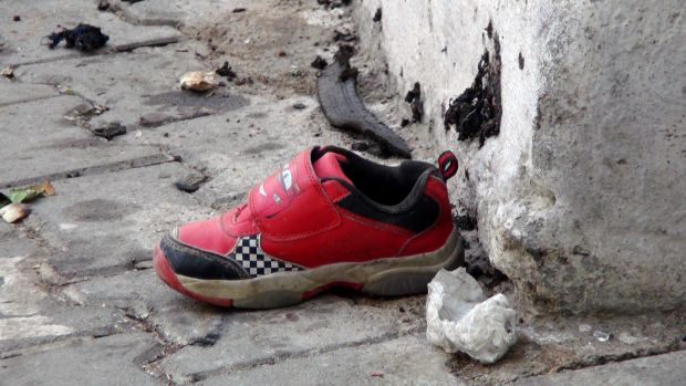 The shoe of a young victim and a piece of metal lay near the scene just hours after Saturday's bomb attack in Gaziantep