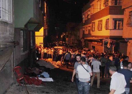 People gather after an explosion in Gaziantep southeastern Turkey early Sunday Aug. 21 2016. Gaziantep Province Gov. Ali Yerlikaya said the deadly blast during a wedding near the border with Syria was a terror attack