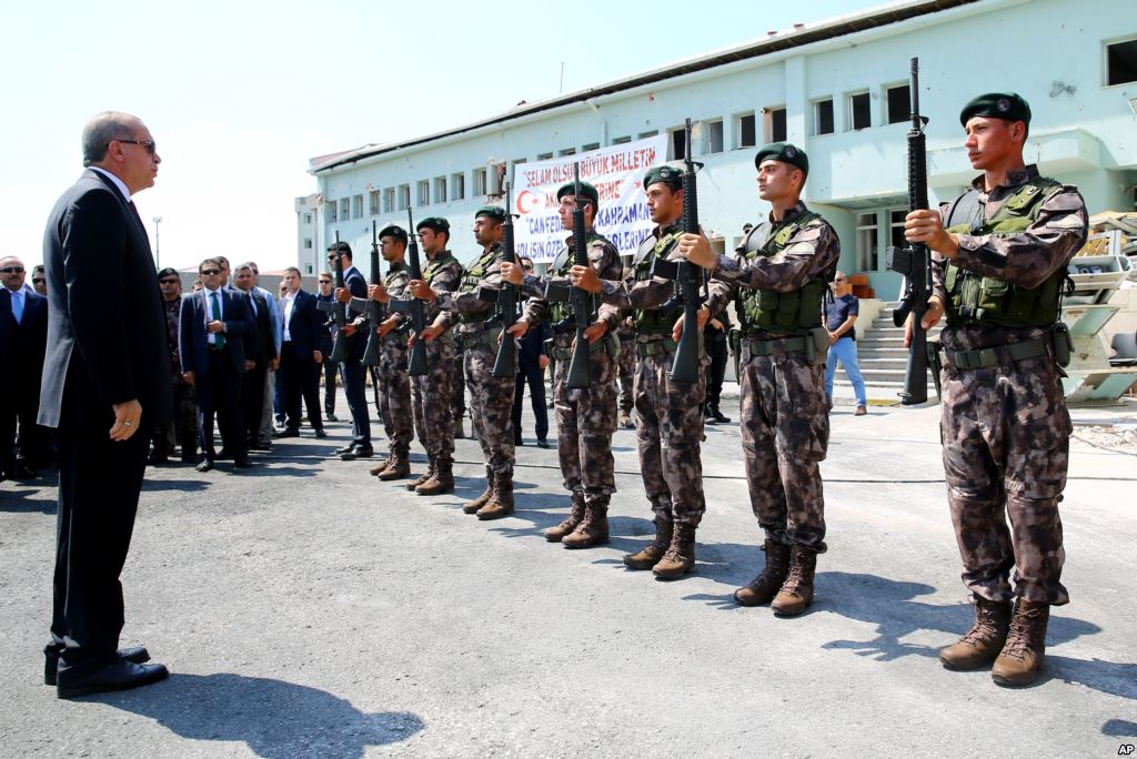 Turkey President Recep Tayyip Erdogan left reviews officers of the special police forces at their headquarters in Ankara Turkey Friday