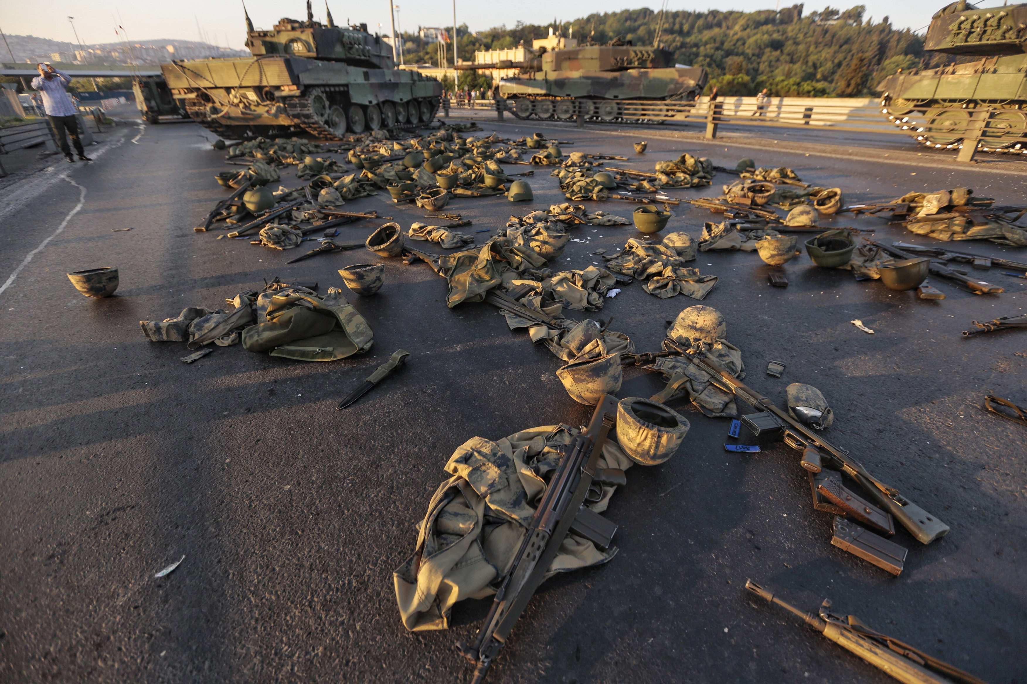 Clothes and weapons belonging to soldiers involved in the coup attempt that surrendered lie on the ground abandoned on Bosphorus bridge