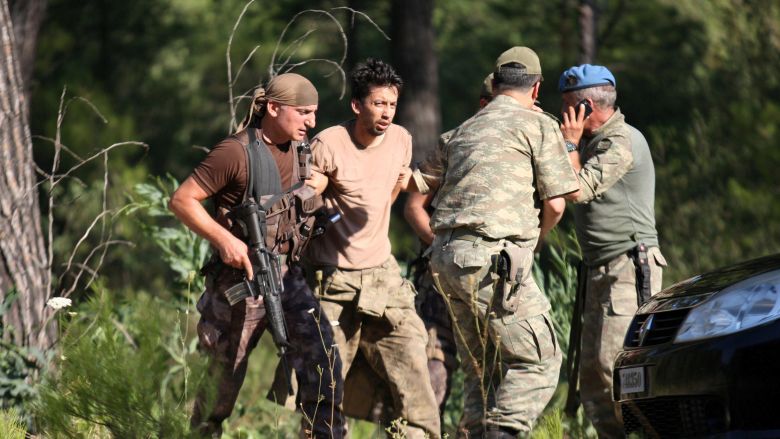 Turkish soldiers detain one of the missing military personnel suspected of being involved in the coup attempt in Marmaris Turkey. Two Turkish military attaches in Greece are missing after being called back to Ankara as part of investigations into last