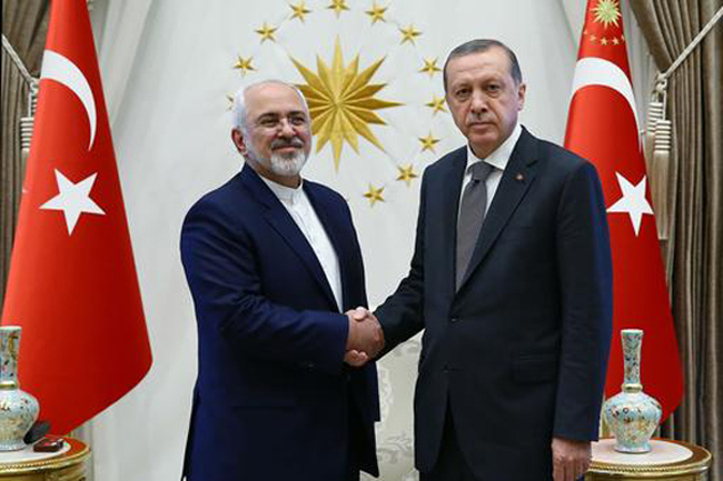 Turkish President Recep Tayyip Erdogan right shakes hands with Iranian Foreign Minister Mohammad Javad Zarif during their meeting in Ankara Friday Aug. 12 2016