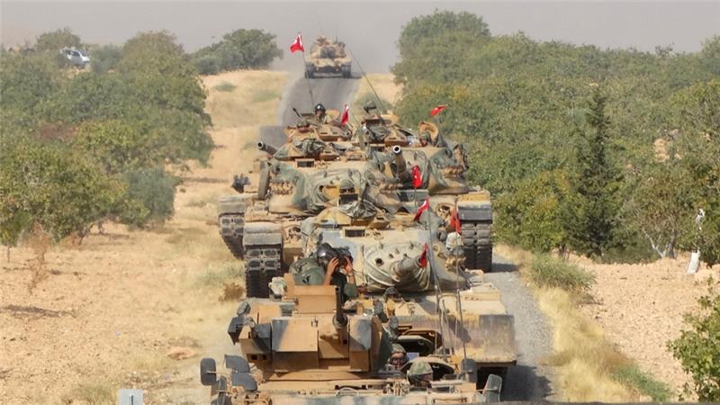 Turkey has deployed dozens of tanks into neighbouring Syria