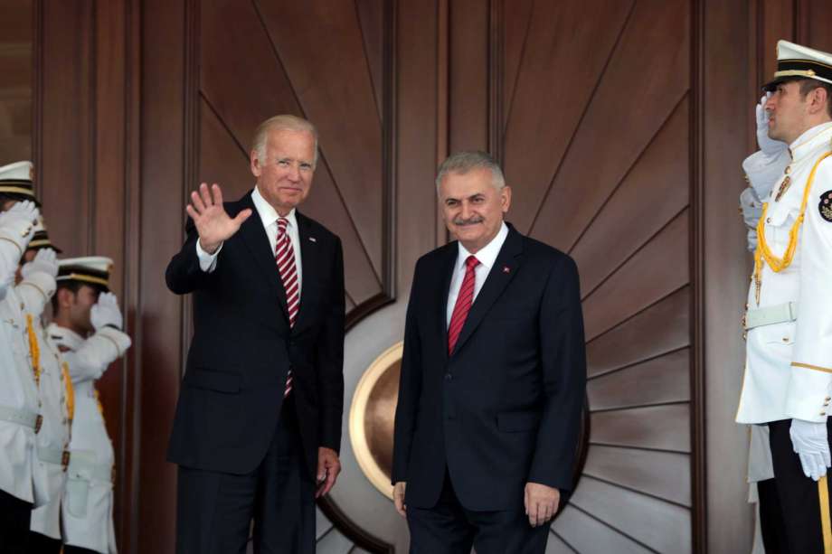 U.S Vice President Joe Biden left waves after he was greeted by Turkish Prime Minister Binali Yildirim in Ankara Turkey Wednesday Aug. 24 2016. Biden has arrived in Ankara for talks with Turkish leaders as Turkey launched a military operation to cle