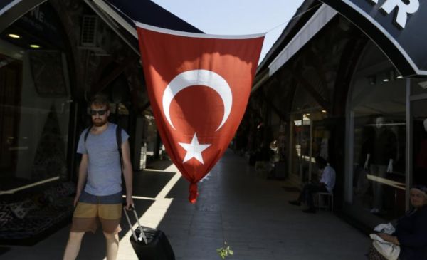 A tourist exits from Arasta Bazaar in the