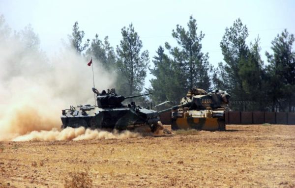 A Turkish army tank and an armored vehicle