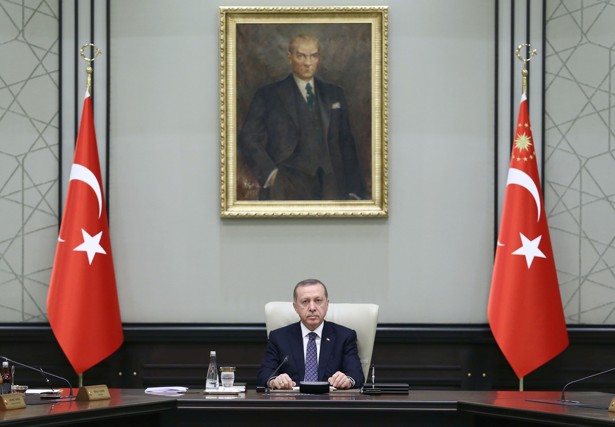 Turkish President Recep Tayyip Erdogan chairs a Cabinet meeting Monday seated under a portrait of Mustafa Kemal Ataturk the founder of modern Turkey