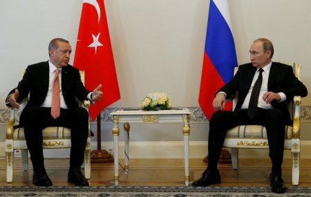 Turkish President Tayyip Erdogan speaks to Russian President Vladimir Putin during their meeting in St. Petersburg Russia