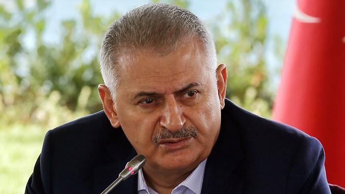 Turkish Prime Minister Binali Yildirim speaks during a meeting with foreign media representatives in Istanbul Saturday Aug. 20 2016