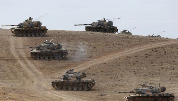 Turkish army tanks take up position on the Turkish Syrian border near the southeastern town of Suruc in Sanliurfa province