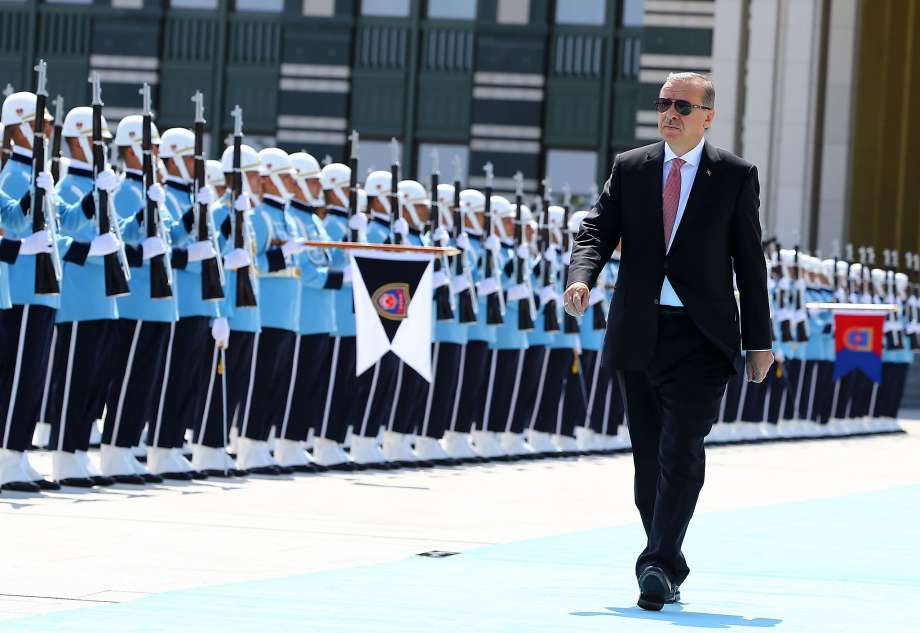 Turkish President Recep Tayyip Erdogan reviews the military guard of honor in Ankara