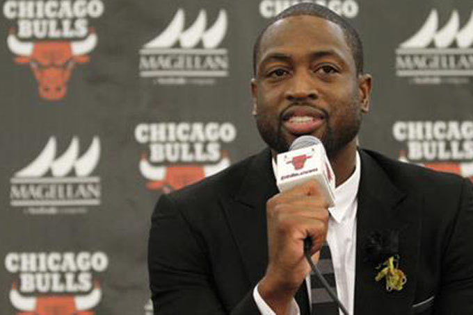 Chicago Bulls player Dwyane Wade speaks during a news conference in Chicago. A family spokesman says a cousin of Wade's was fatally shot Friday Aug. 25 while pushing a baby in a stroller on the city's South Side. Wade