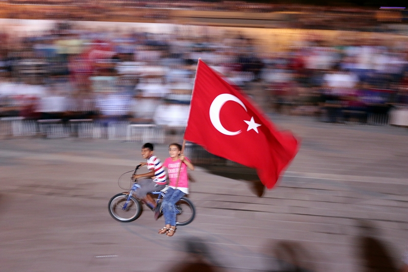 Two Children wave Turkish flag