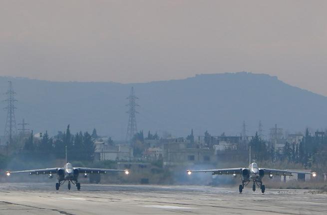 Two Russian Sukhoi Su-24 bombers at the Russian Hmeimim military base in Latakia province