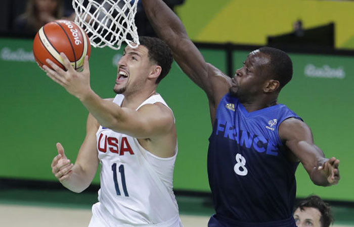 United States Klay Thompson shoots past France's Charles Kahudi during a men's basketball game at the 2016 Summer Olympics in Rio de Janeiro Brazil Sunday Aug. 14 2016. — AP