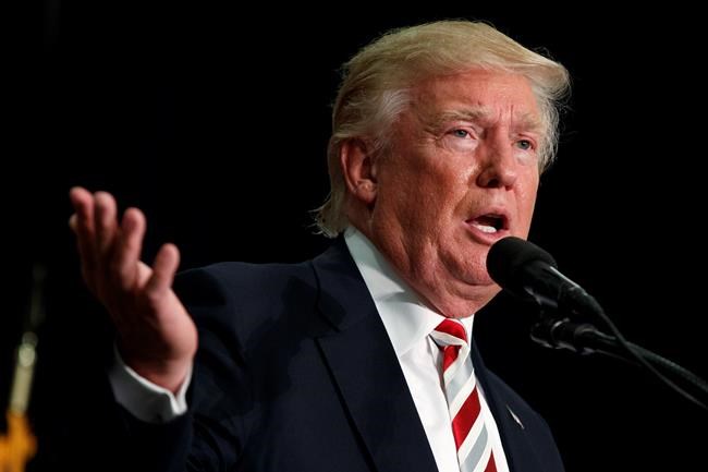 Republican presidential nominee Donald Trump speaks during a campaign rally at Windham High School in Windham N.H. Trump is focusing his economic message on boosting jobs and making the country more comp