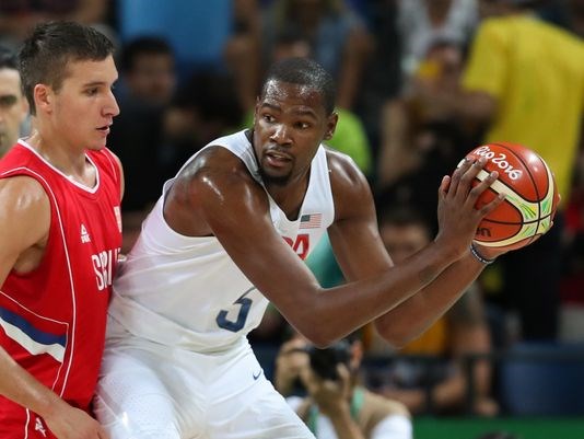 U.S. forward Kevin Durant looks for room to work against Serbia defender Bogdan Bogdanovic