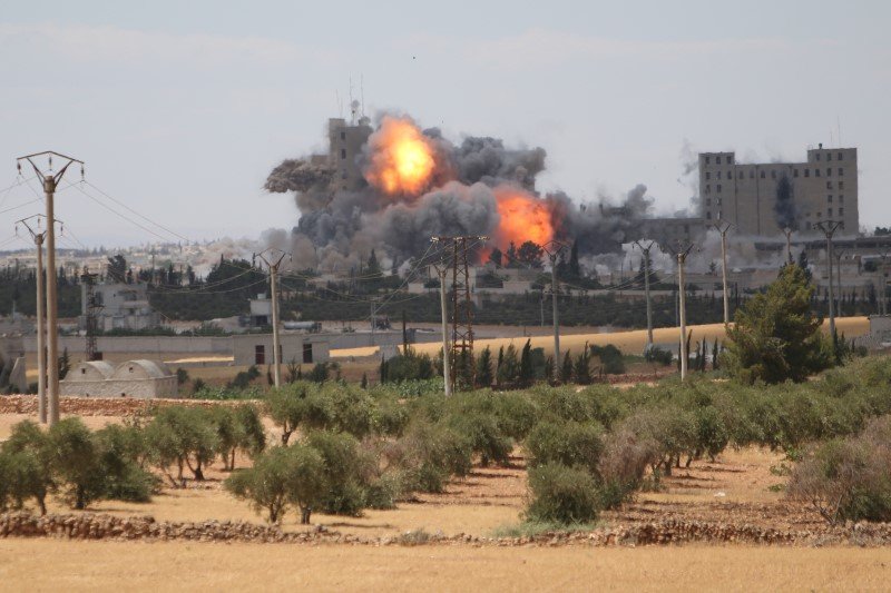 Smoke and flame rise after what fighters of the Syria Democratic Forces said were U.S.-led air strikes on the mills of Manbij where Islamic State militants are positioned in Aleppo Governorate Syria