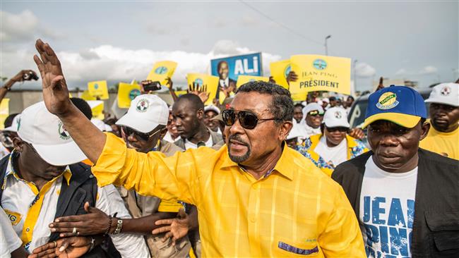 Gabonese opposition candidate Jean Ping greets supporters gathered at a rally in the capital city Libreville on the last day of the presidential election campaign