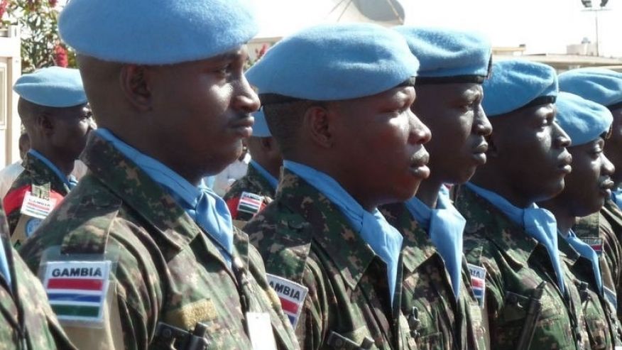 UN peacekeepers of the joint African Union United Nations Mission in Darfur stand guard