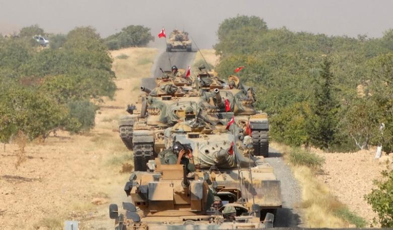 Turkish army tanks make their way towards the Syrian border town of Jarablus Syria