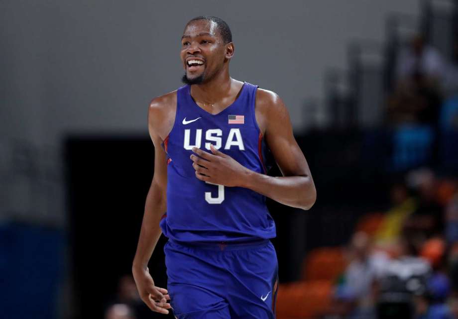 United States Kevin Durant smiles after making a three-point basket during a basketball game against China at the 2016 Summer Olympics in Rio de Janeiro Brazil Saturday Aug. 6 2016. ORG XMIT OBKO122