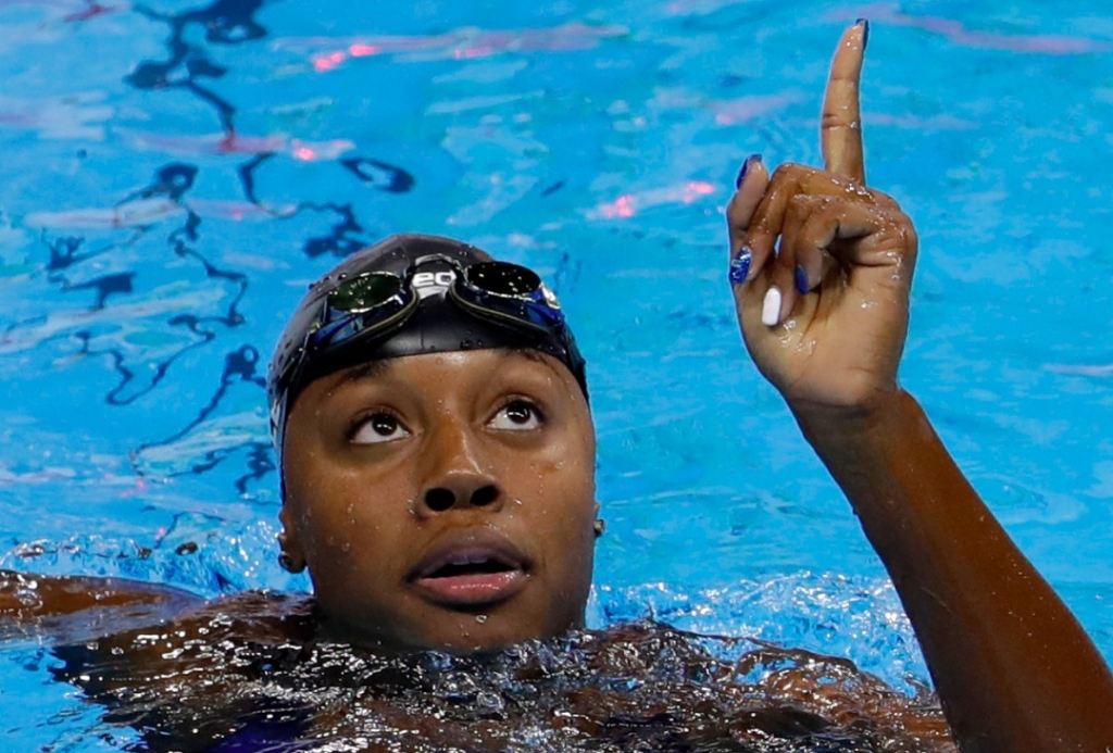 United States Simone Manuel wins the gold medal setting a new Olympic record in the women's 100-meter freestyle during the swimming competitions at the 2016 Summer Olympics Thursday Aug. 11 2016 in Rio de Janeiro Brazil