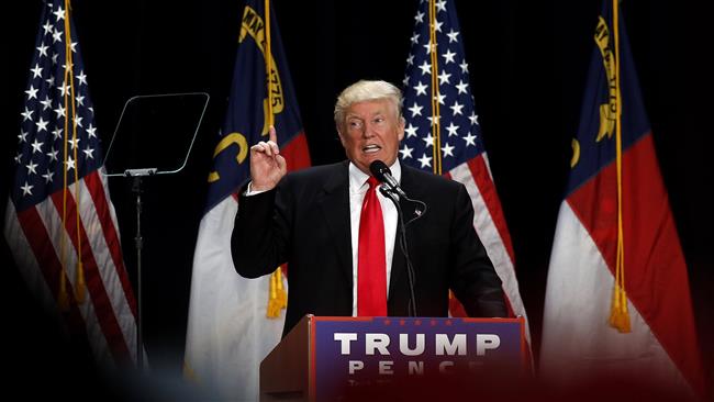 US Republican presidential candidate Donald Trump speaks to supporters at a rally in Charlotte North Carolina