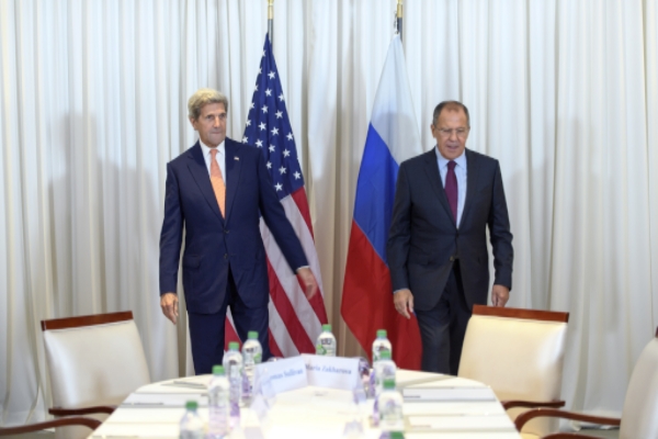 U.S. Secretary of State John Kerry left and Russian Foreign Minister Sergei Lavrov right at a bilateral meeting in Geneva Switzerland on Aug. 26