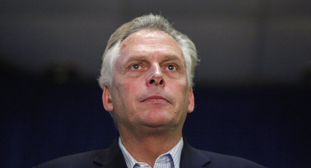 Democratic nominee for Virginia governor Terry Mc Auliffe stands onstage during a campaign rally in Dale City Virginia