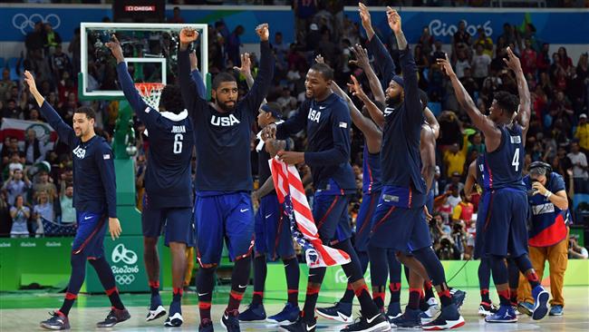 US players celebrate winning a Men's Gold medal basketball match between Serbia and USA at the Carioca Arena 1 in Rio de Janeiro