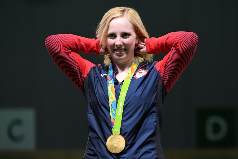 USA's gold medallist Virginia Thrasher poses on the podium during the medal ceremony for the women's 10m air rifle shooting event at the Rio 2016 Olympic Games at the Olympic Shooting Centre in Rio de Janeiro