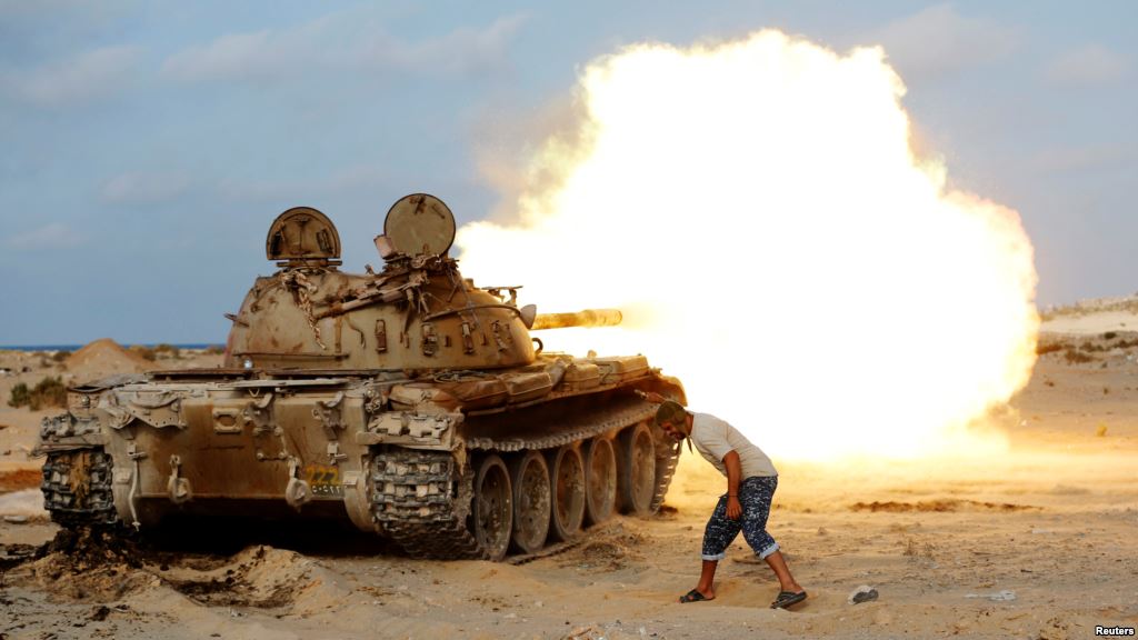 A fighter from Libyan forces allied with the U.N.-backed government fires a shell with a Soviet-made T-55 tank at Islamic State fighters in Sirte Libya Aug. 2 2016