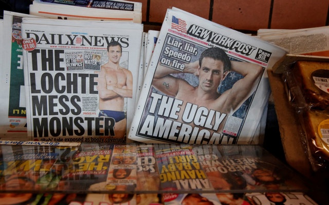 The front pages of the New York Post and the New York Daily News display the image of US Olympic swimmer Ryan Lochte in New York US