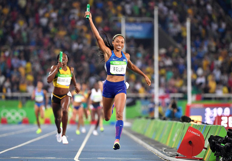 USA's Allyson Felix celebrates as she crosses the finish line to win the Women's 4x400