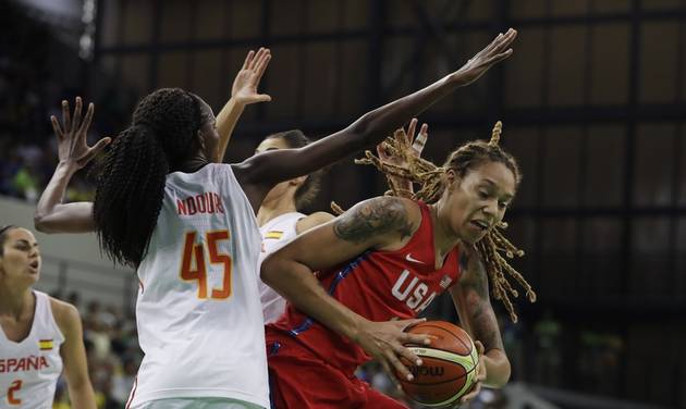 United States center Brittney Griner goes up against the defense of Spain forward Astou Ndour during the first half of a women's basketball game at the Youth Center at the 2016 Summer Olympics in Rio de Janeiro Brazil Monday Aug. 8 2016. (AP Phot