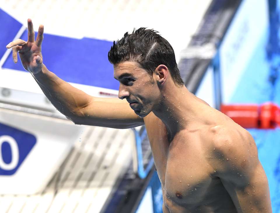 Michael Phelps won before and after his Olympic race Tuesday