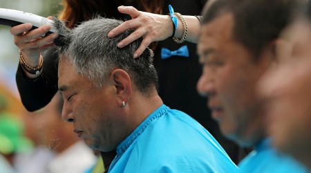 Seongju residents get their heads shaved during a protest against the government's decision to place a U.S. Terminal High Altitude Area Defence anti-missile defence unit in their town in Seongju South Korea