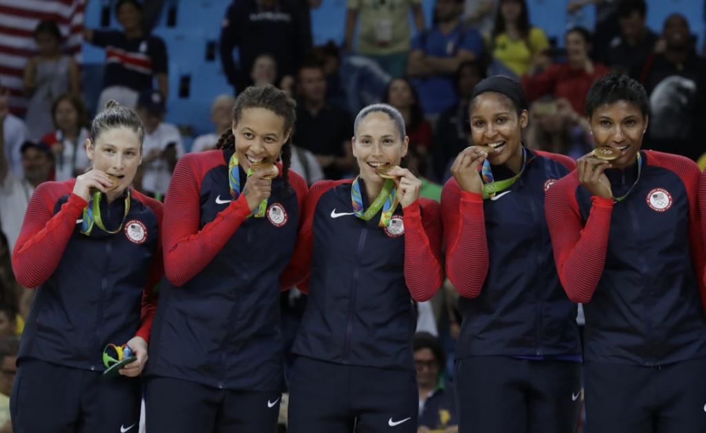 United States&#039 Lindsay Whalen from left Seimone Augustus Sue Bird Maya Moore and Angel McCoughtry pose with their gold medals after their win over Spain in a women's gold medal basketball game at the 2016 Summer Olympics in Rio de Janeiro