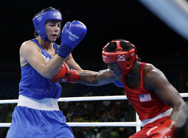 Gold medalist Claressa Maria Shields of the United States poses on the podium during the medal ceremony for the Women's Boxing Middle on Day 16 of the Rio 2016 Olympic Games at Riocentro- Pavilion 6