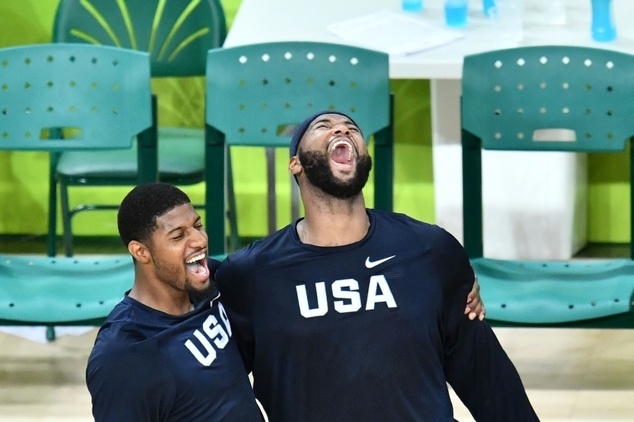 USA's guard Paul George and centre De Marcus Cousins celebrate winning the men's basketball gold medal