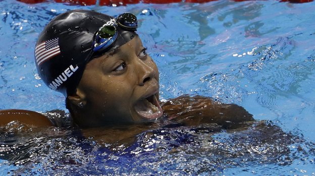 United States&#039 Simone Manuel celebrates winning the gold medal and setting a new olympic record in the women's 100-meter freestyle during the swimming competitions at the 2016 Summer Olympics Thursday Aug. 11 2016 in Rio de Janeiro Brazil