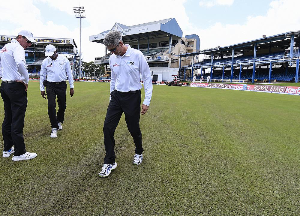 Umpires inspecting the conditions on day two of the second Test