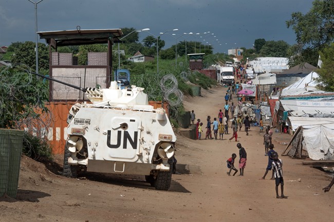 25 2016 some of the more than 30,000 Nuer civilians sheltering in a United Nations base in South Sudan's capital Juba for fear of targeted killings by government forces walk by an armored vehicle and a watchtower